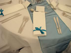 White Chair Covers and Teal Sashes